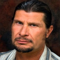 Joey Beecher Rough-looking man with dark hair, mustache and goatee